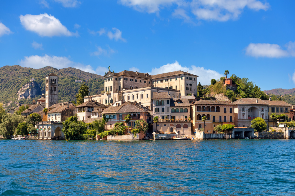 View of monastery on famous San Giulio island on Lake Orta in Piedmont, Northern Italy.