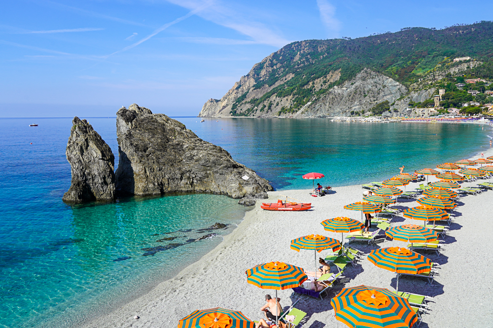 Monterosso al Mare Cinque Terre Liguria, Italy. Beach chairs on the beach with turquoise water.