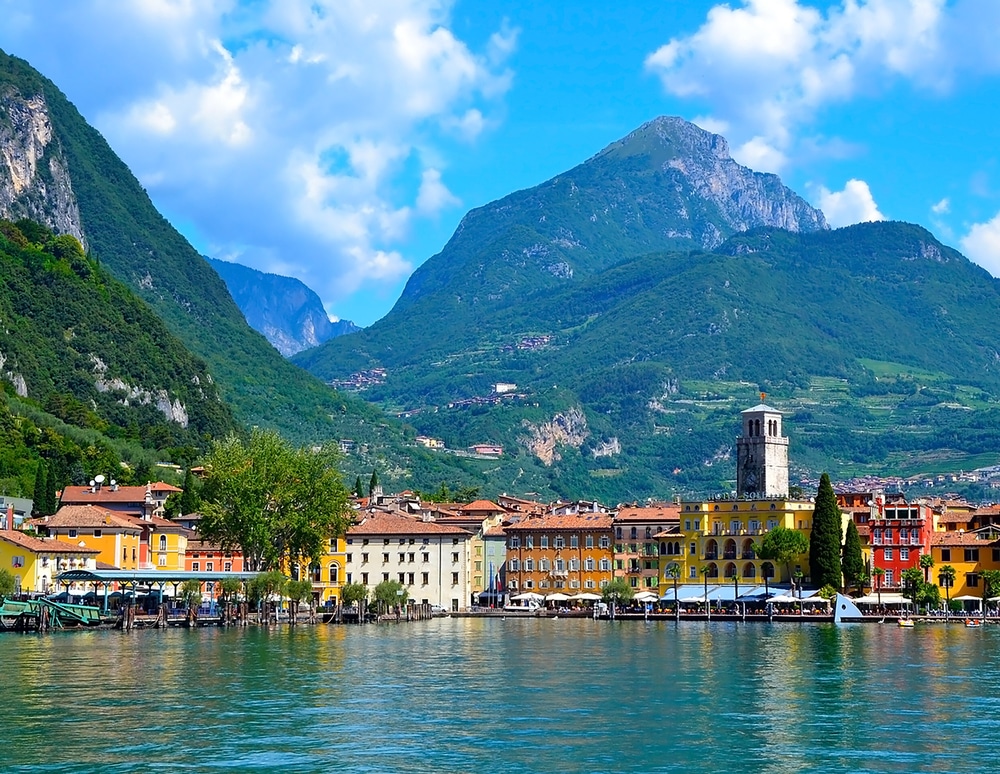 lakeside town with mountains in the background Rive del Garda Lake Garda