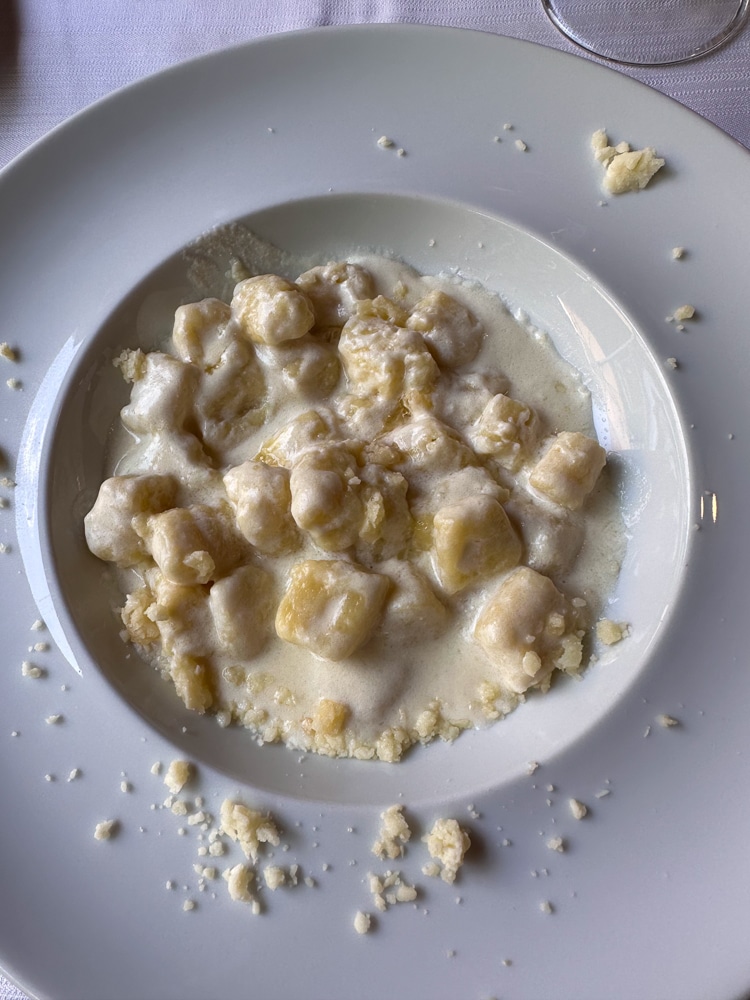 a dish of gnocchi with castelmagno cheese