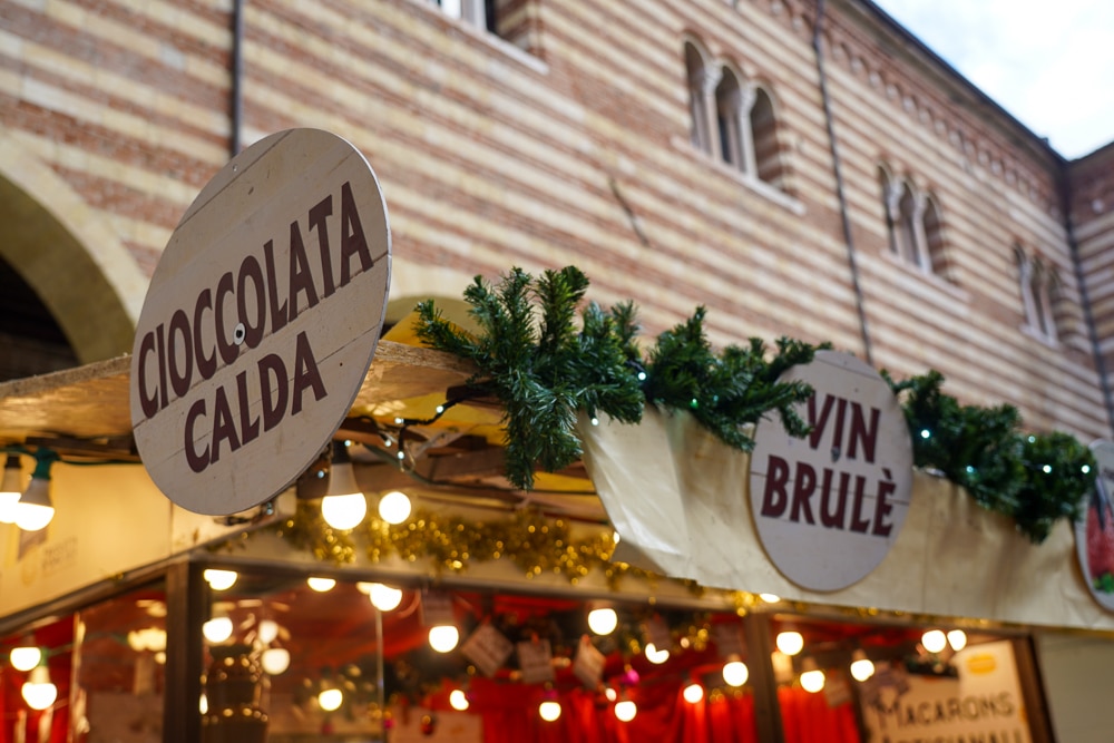 close up of signs and lights at a christmas kiosk in Verona Italy