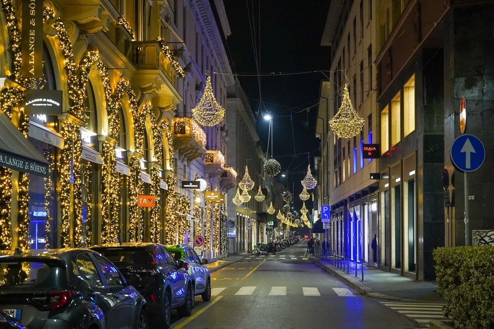 Christmas lights in Milan Italy draped on buildings and across the street