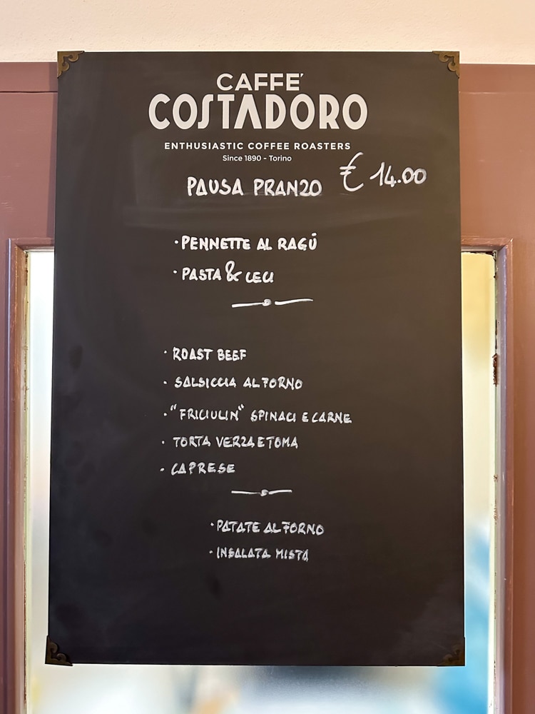 handwritten menu in Italian at a restaurant in Italy