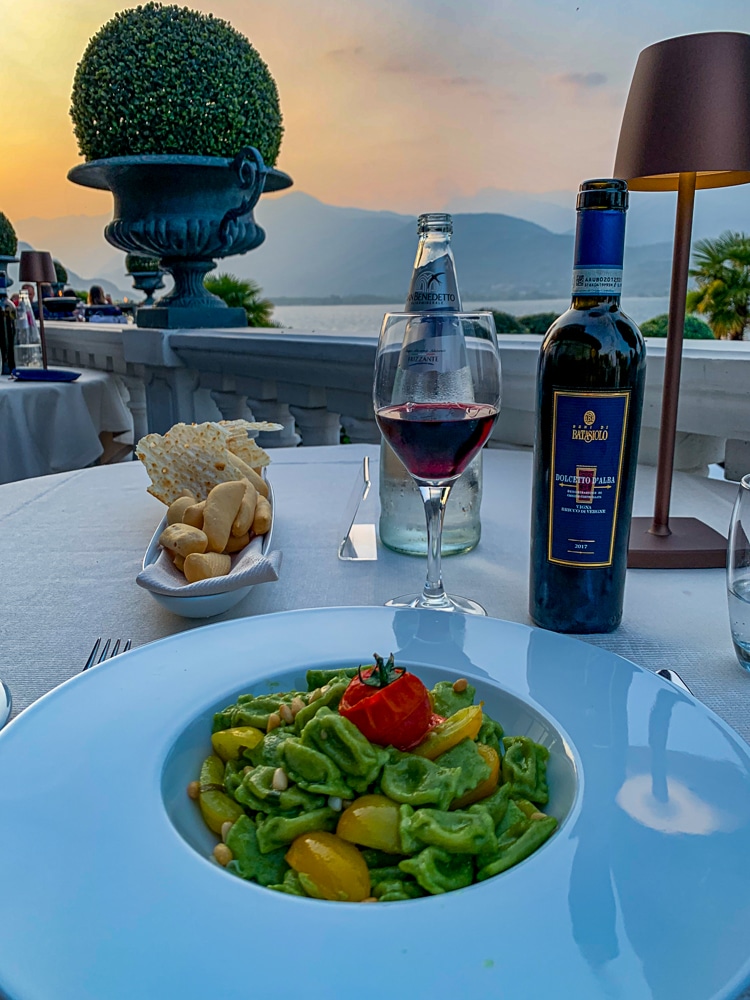 Pasta, wine, and bread with Lake Maggiore Italy views