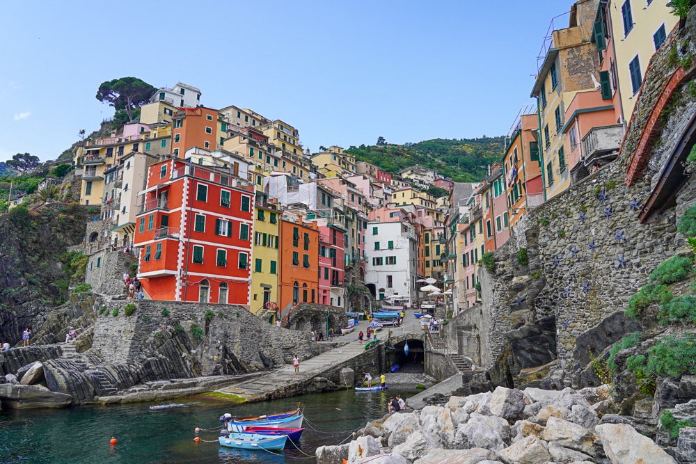 Riomaggiore Cinque Terre - view of the village from the rocks in the harbor