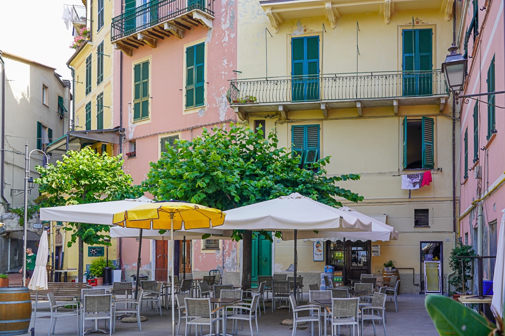 outdoor cafe tables in a Monterosso Cinque Terre piazza