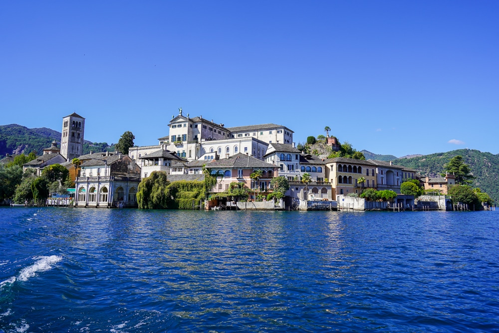view of Isola San Giulio from a boat on Lake Orta in Italy