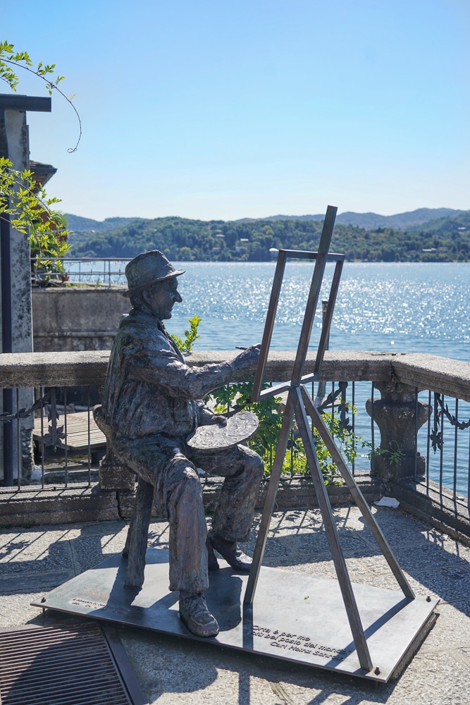 Statue of a painter next to Lake Orta Italy