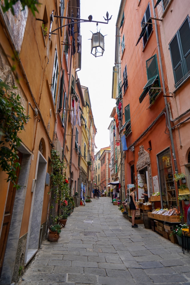 Portovenere italy main street going uphill with colorful houses on both sides