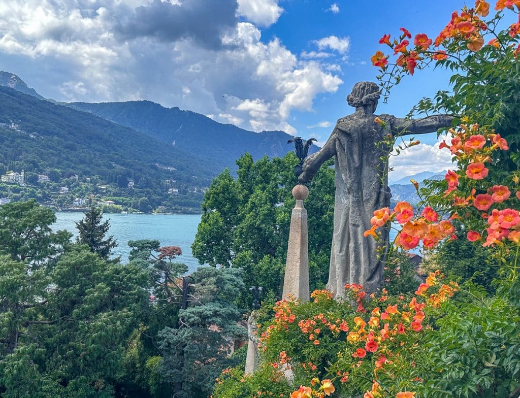gardens at Isola Bella Lake Maggiore with statues and orange flowers with lake views