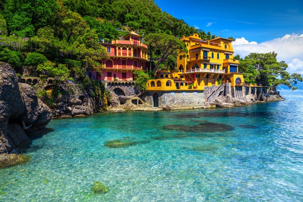 Beautiful summer holiday destination, colorful luxury seaside villas and stunning beach with clean turquoise water, Portofino, Liguria, Italy, Europe