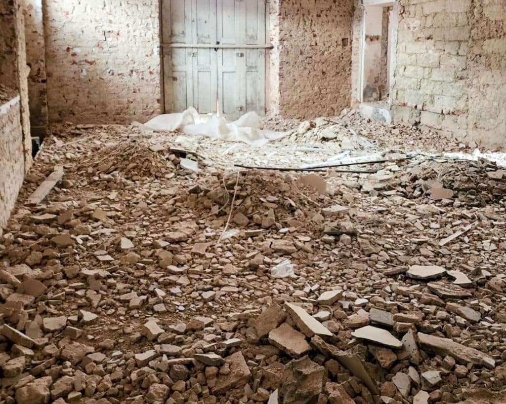 italy house renovation of a room full of rubble on the ground