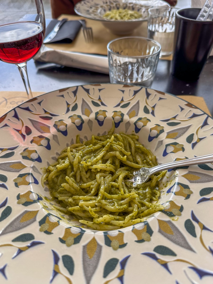 pesto pasta in a bowl on a table at a restaurant in Camogli
